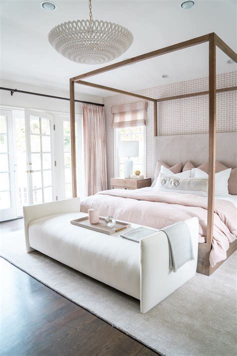 A four-poster bed in a modern bedroom